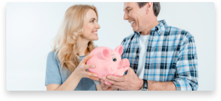 Man and woman holding a stuffed pig plush and smiling